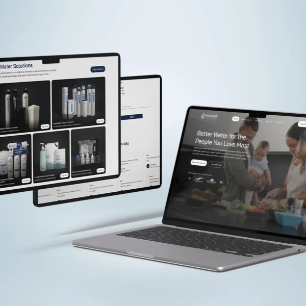 Laptop and tablet screens displaying the HydraLive water solutions website with product offerings and a family-focused homepage design.